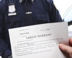 Article 7 A professional lawyer consulting with a client about legal documents in an office, symbolizing expert assistance with addressing arrest warrants in Thailand provided by the lead law firm in Bangkok.