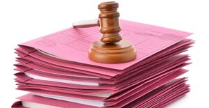 Article 11 "Close-up of court documents including a court summons and enforcement order, with legal text and stamps, representing legal proceedings in Thailand."