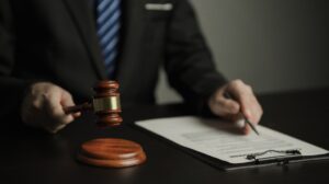 Article 6 A legal professional reviewing administrative law documents in a Bangkok law firm office. thai LITIGATION