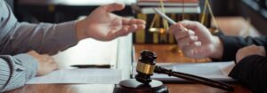 A judge's gavel resting on a legal document discussing adultery laws in Thailand, symbolizing the legal implications of extramarital affairs.