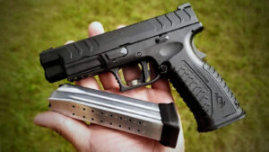 A person holding a legally registered firearm in Thailand, illustrating the legal requirements for firearm carrying under Thai law.