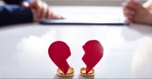 Article 1 Courtroom scene representing adultery claims in Thailand with legal documents and wedding rings on table