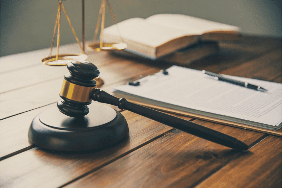 Illustration showing Burden of Proof concept in Thailand civil litigation with a judge’s gavel and legal documents, representing a lead law firm in Bangkok.