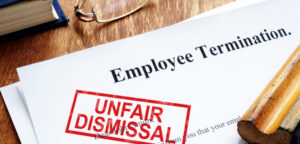 Unfair dismissal consultation between employee and labor law attorney at a lead law firm in Bangkok office